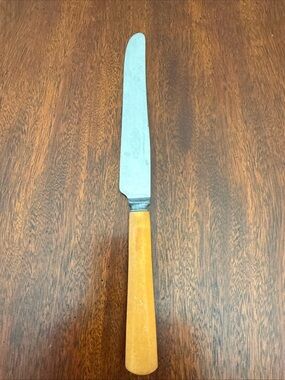 Bakelite butterscotch handle  dinner knife stainless steel Vintage